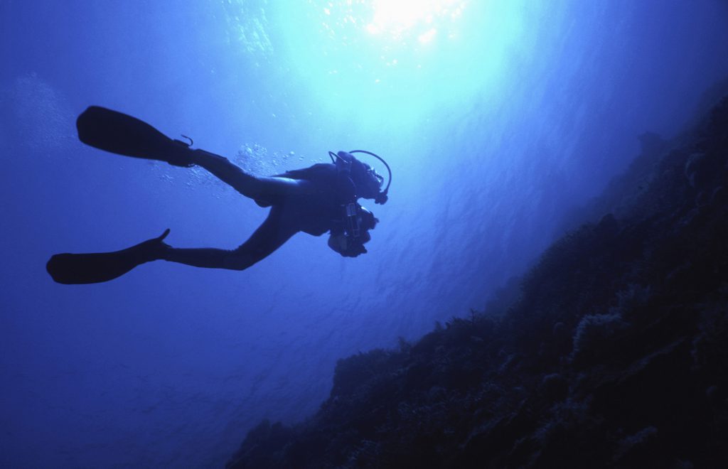 Scuba diver swimming underwater